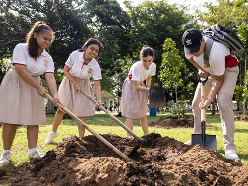 sowingtheseedsofharmony-students-shovel
